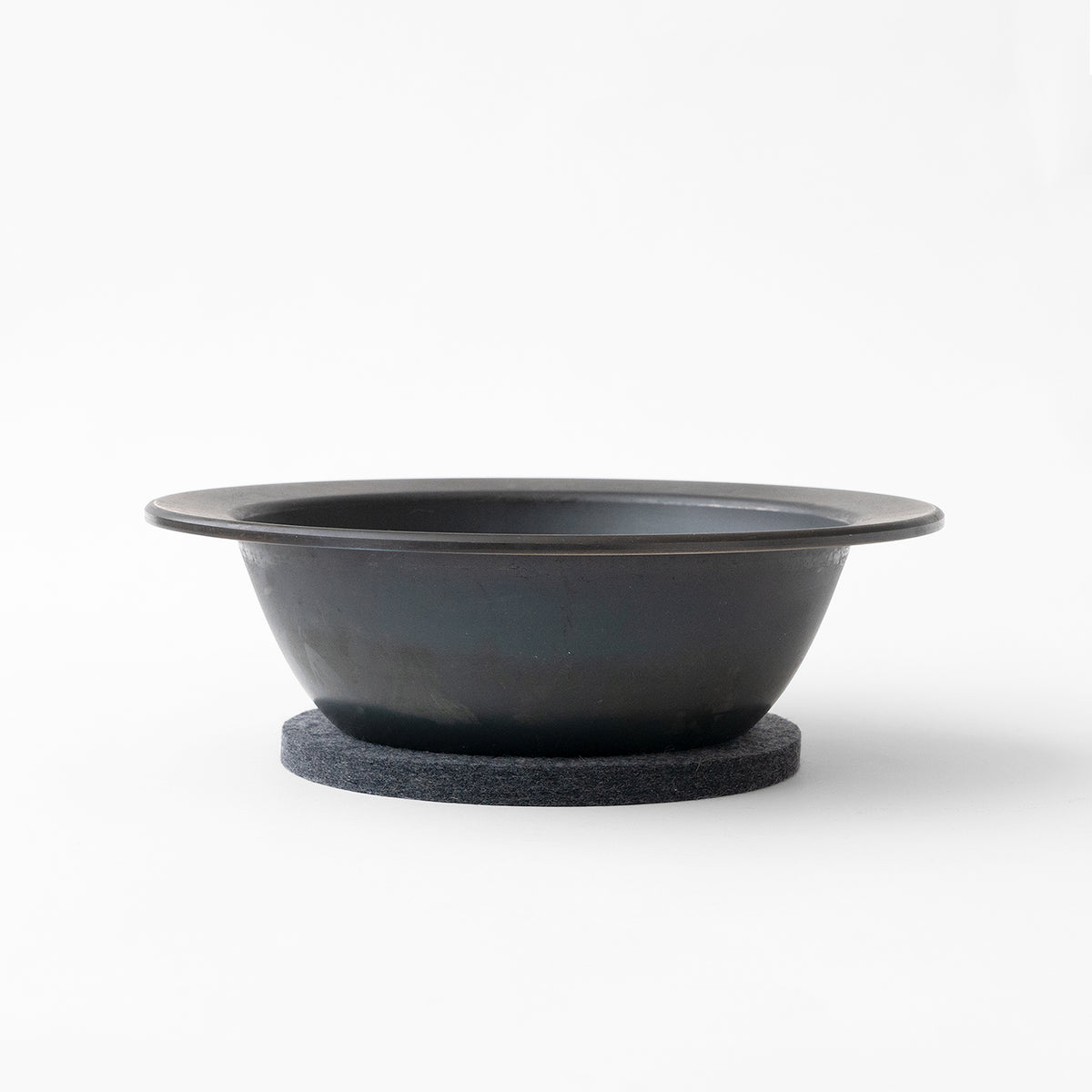 Frying Pan JIU Deep M black iron pan on felt trivet at SF76