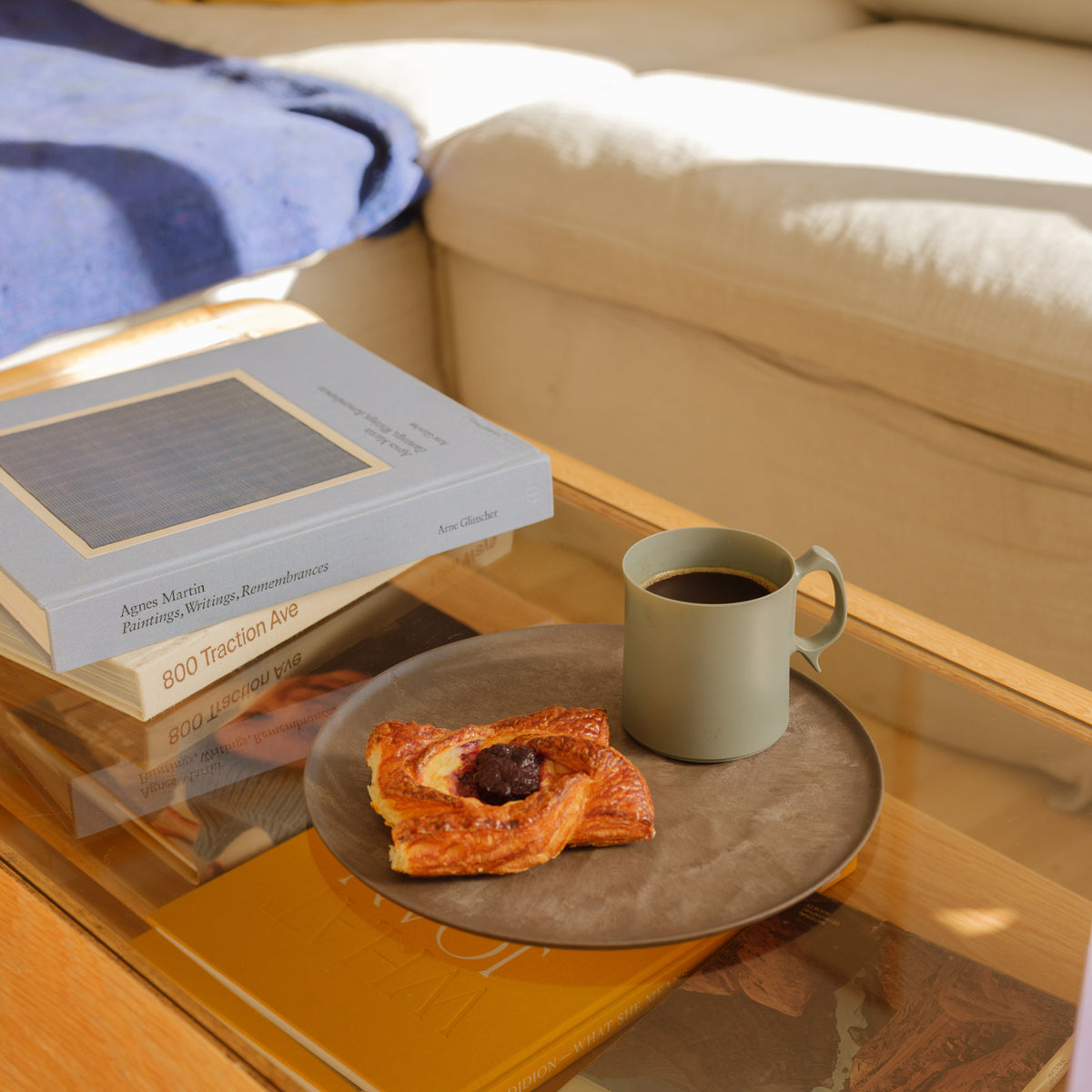 ARAS Mug on coffee table with plate and pastry at SF76