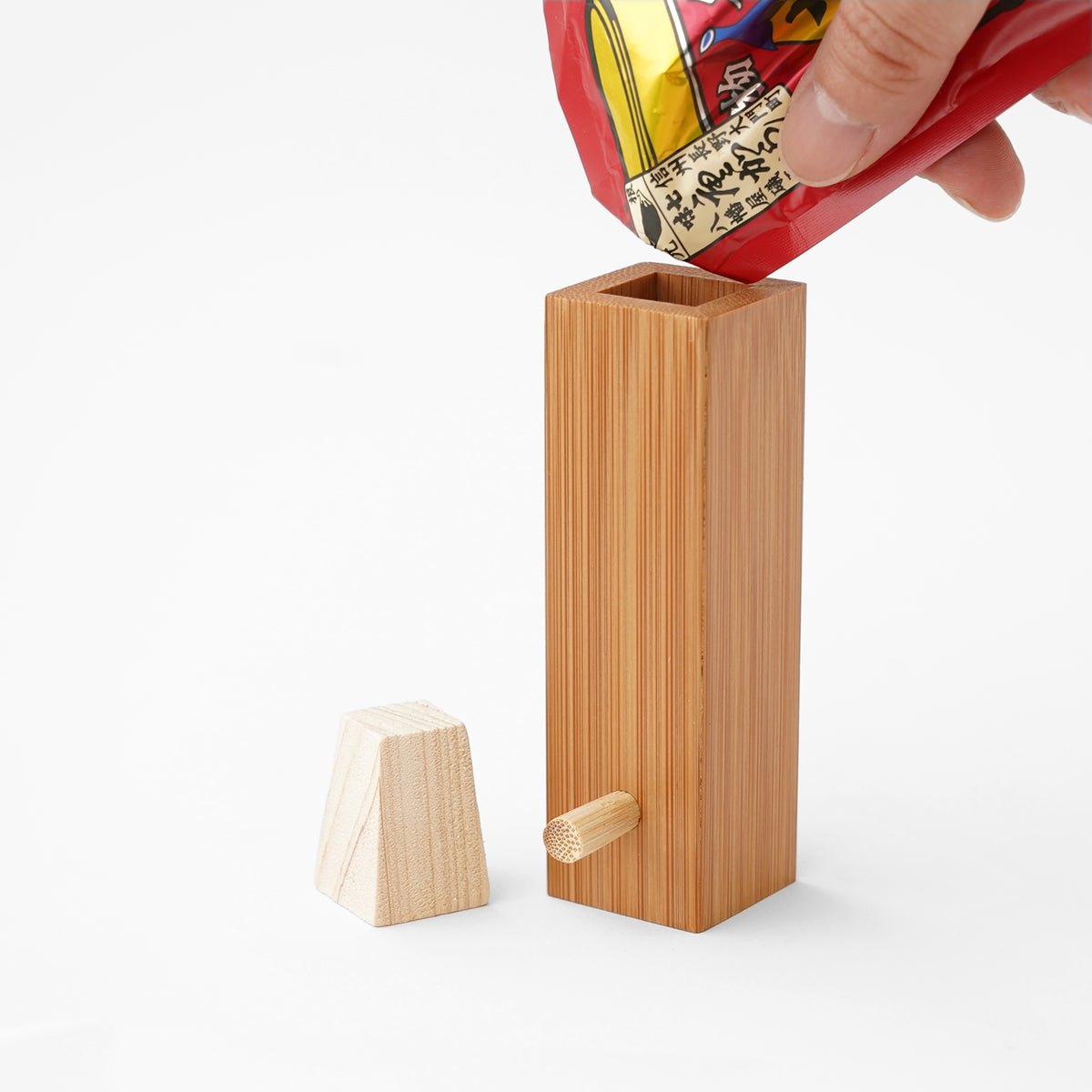Bamboo spice container being filled with seasoning packet at SF76