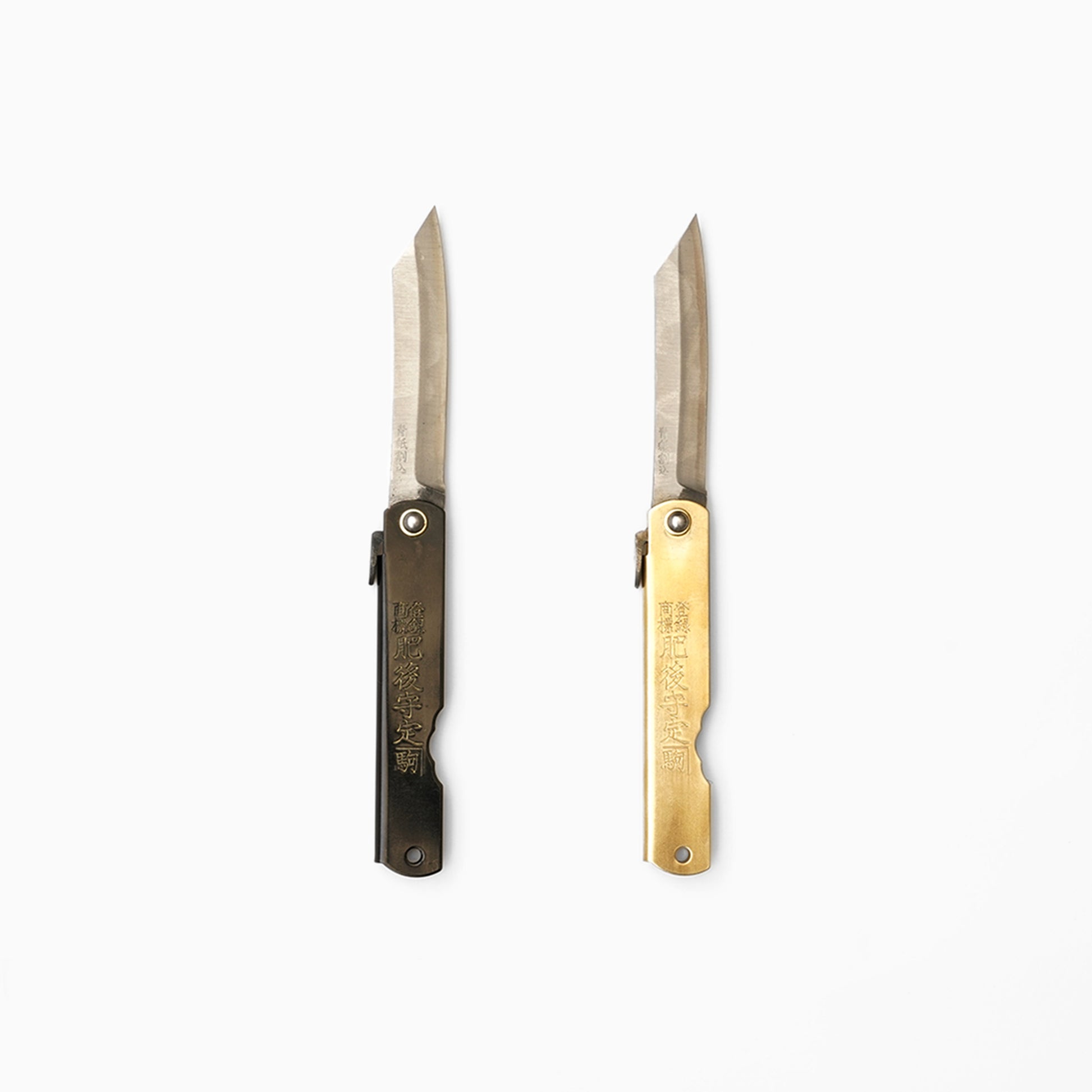 Nagao Kanekoma folding knives in black and brass handles at SF76